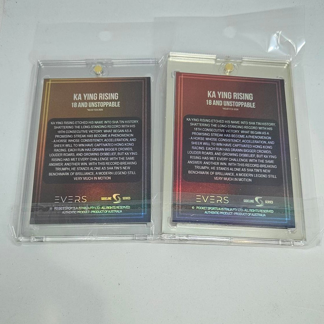 Two trading cards in protective sleeves on a white background